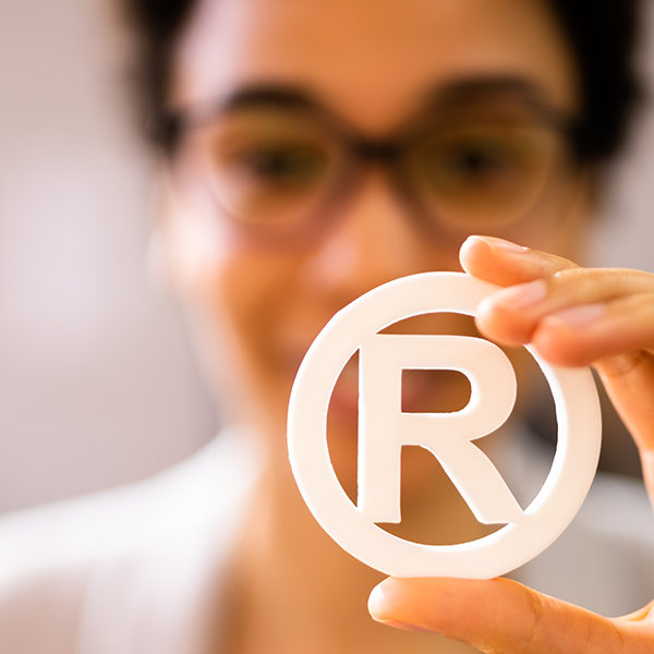 Woman Holding Registered Trademark Symbol