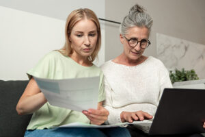 woman and daughter reviewing documents